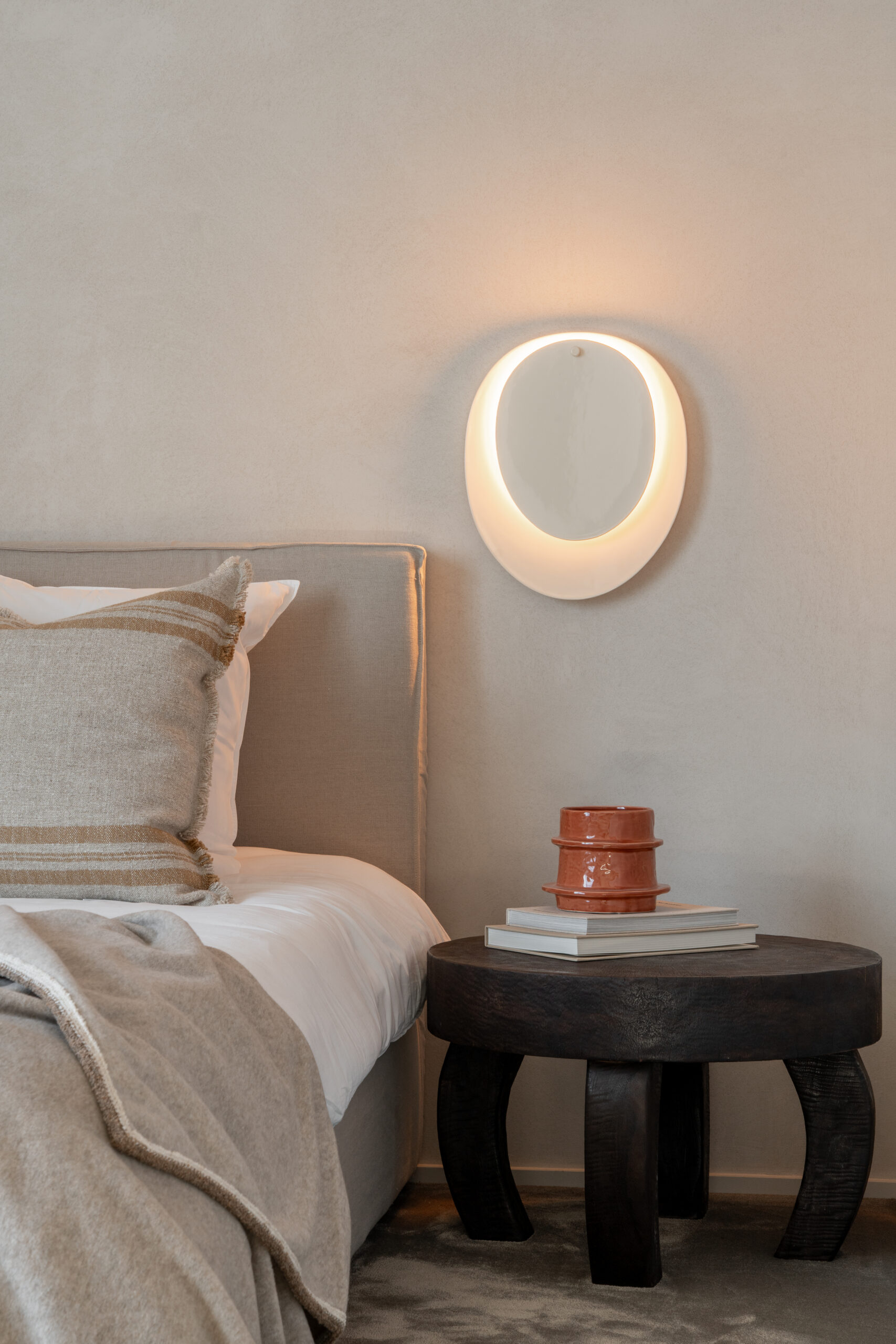 Bed with linen headboard