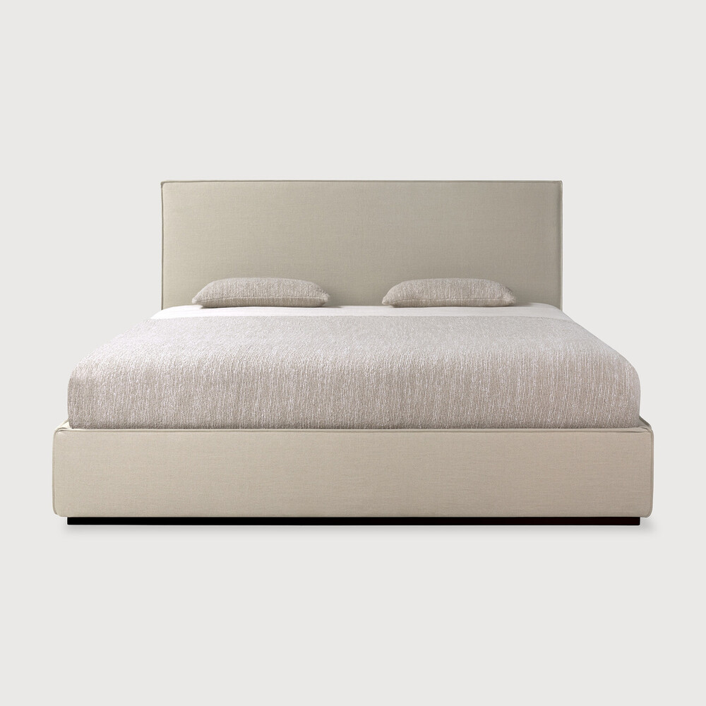 Bed with linen headboard