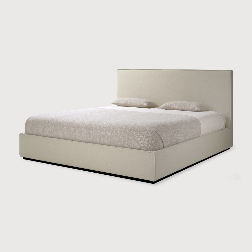 Bed with linen headboard